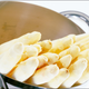 White asparagus in a colander